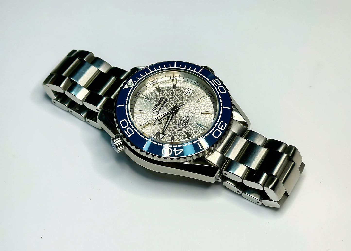 43.5mm Planet Ocean Automatic Homage Watch- Silver textured Dial & Blue Bezel