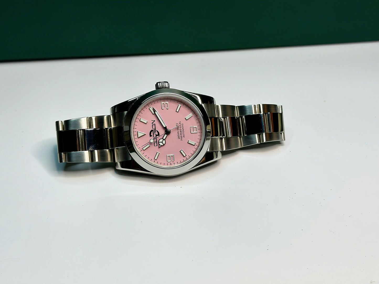 36mm Pink Explorer Automatic Watch on polished center link bracelet