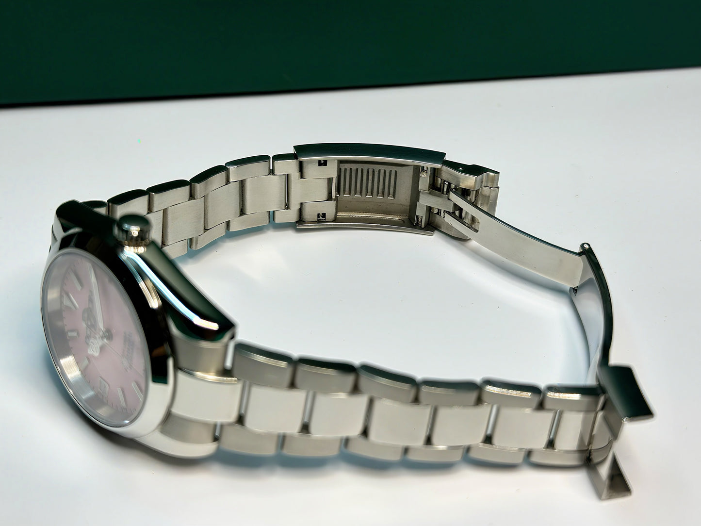 36mm Pink Explorer Automatic Watch on polished center link bracelet