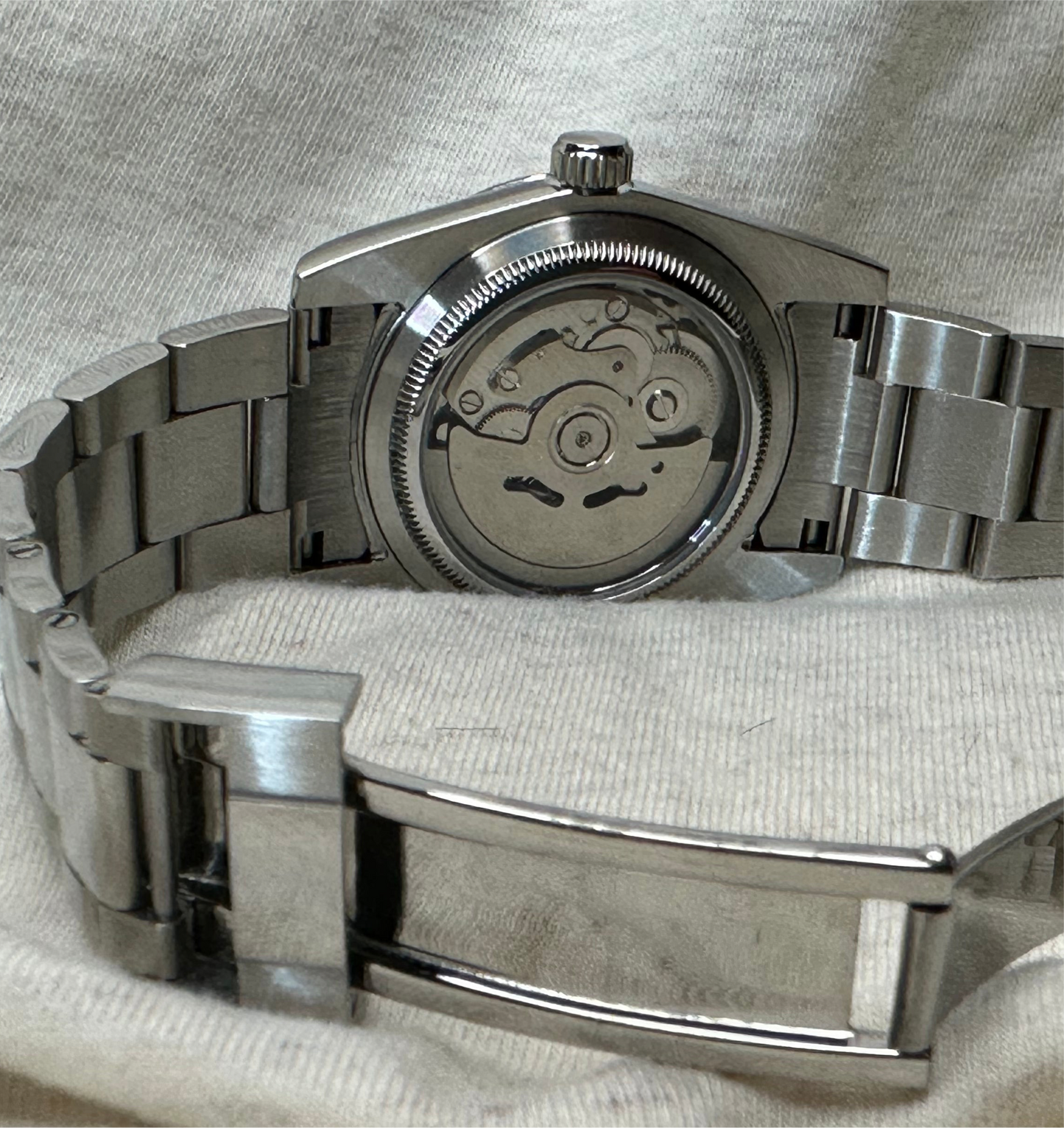 36mm Pink Explorer Automatic Watch on polished center link bracelet