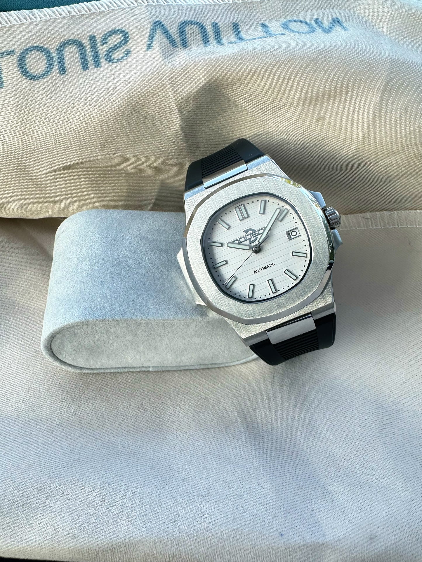 Nautilus style white dial automatic watch