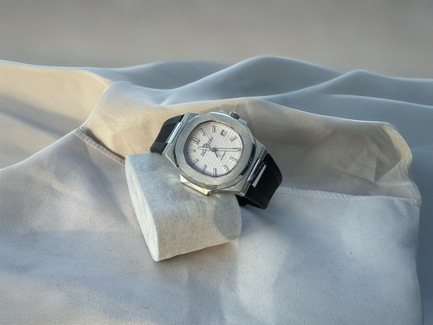 Nautilus style white dial automatic watch