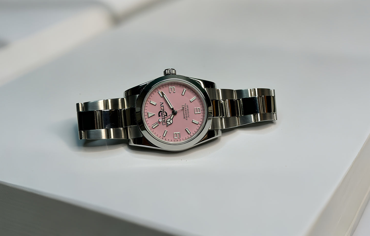 36mm Pink Explorer Automatic Watch on polished center link bracelet