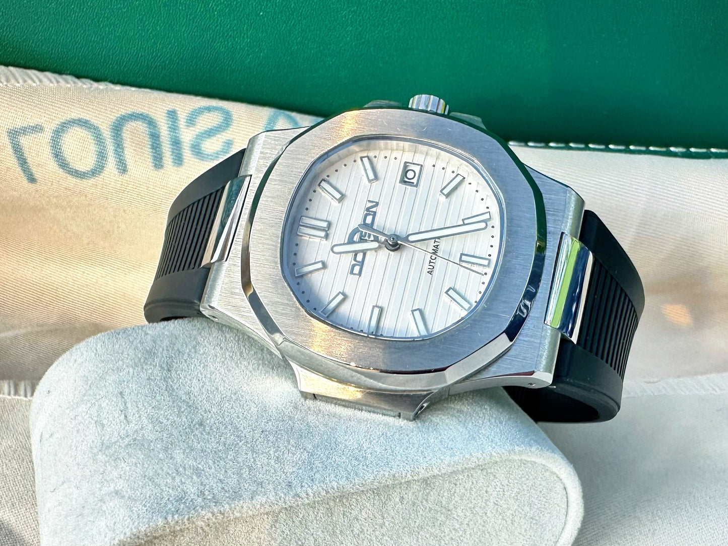 Nautilus style white dial automatic watch